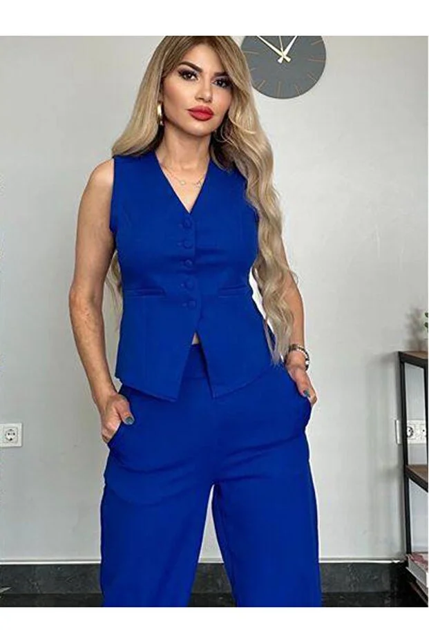 طقم صدرية وبنطال أنيق بخصّة ضيقة كحلي